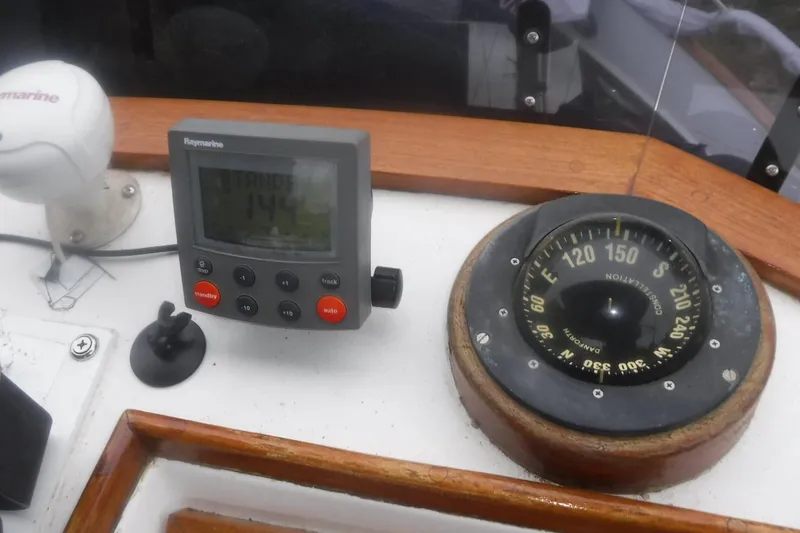 Slide: The Image of Navigation instruments on a 1983 Grand Banks 36 Classic boat dashboard. - 13