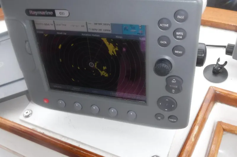 Slide: The Image of Raymarine radar display on 1983 Grand Banks 36 Classic boat dashboard. - 14