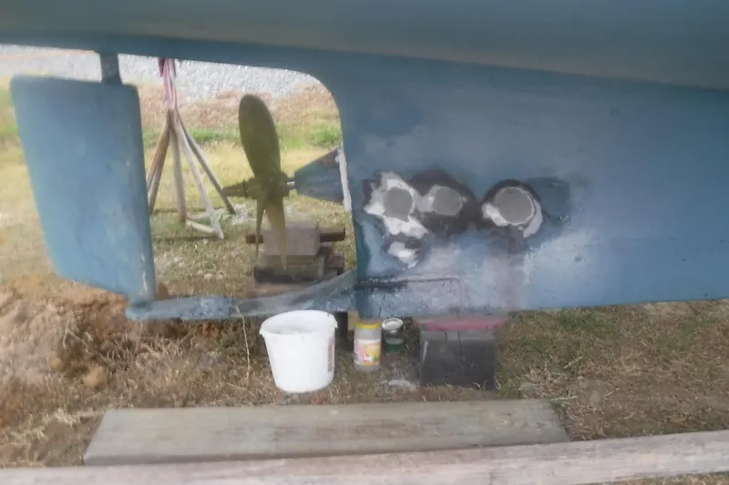 Slide: The Image of 1983 Grand Banks 36 Classic boat hull repair with visible propeller and rudder. - 2