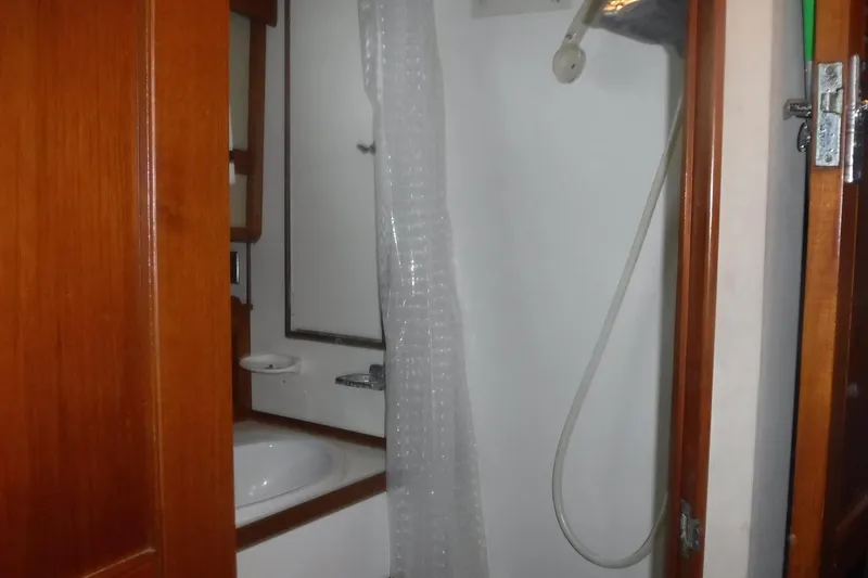 Slide: The Image of Bathroom interior of 1983 Grand Banks 36 Classic yacht with shower and wooden accents. - 29