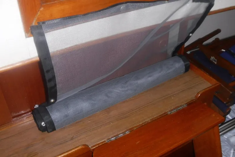 Slide: The Image of Roll-up mesh screen on 1983 Grand Banks 36 Classic wooden interior. - 36