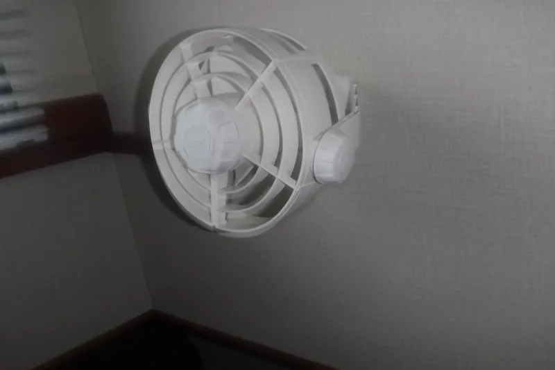 Slide: The Image of Wall-mounted fan inside 1983 Grand Banks 36 Classic boat cabin. - 37
