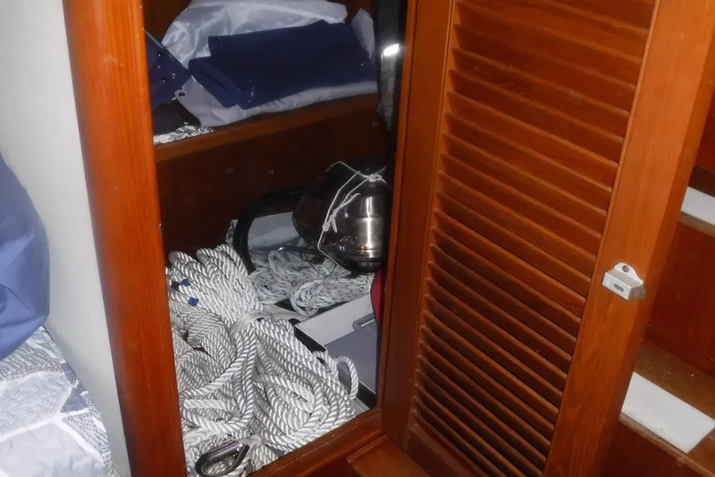 Slide: The Image of Storage area inside 1983 Grand Banks 36 Classic boat with ropes and equipment. - 42