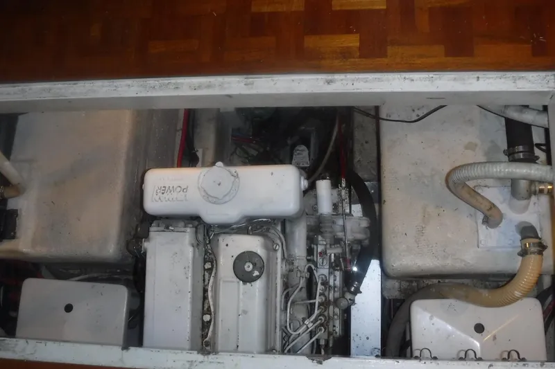 Slide: The Image of Engine compartment of a 1983 Grand Banks 36 Classic boat, showcasing mechanical components. - 47