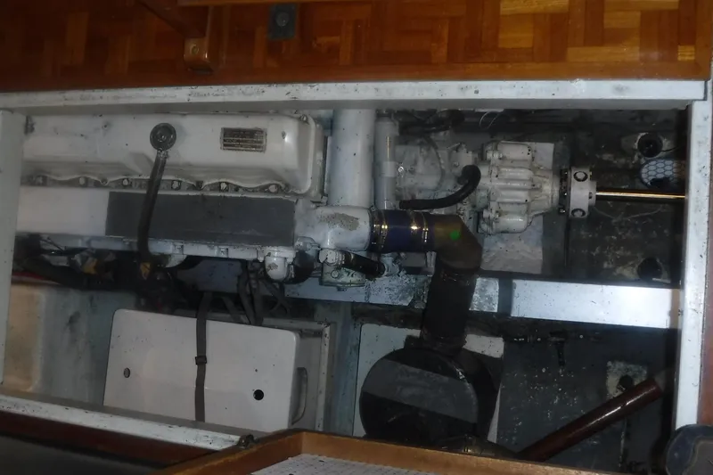 Slide: The Image of Engine compartment of a 1983 Grand Banks 36 Classic boat, showcasing mechanical components. - 48