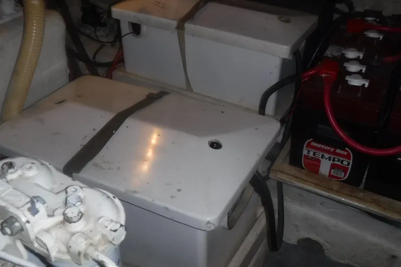 Slide: The Image of Battery compartment of 1983 Grand Banks 36 Classic boat with multiple battery boxes. - 53