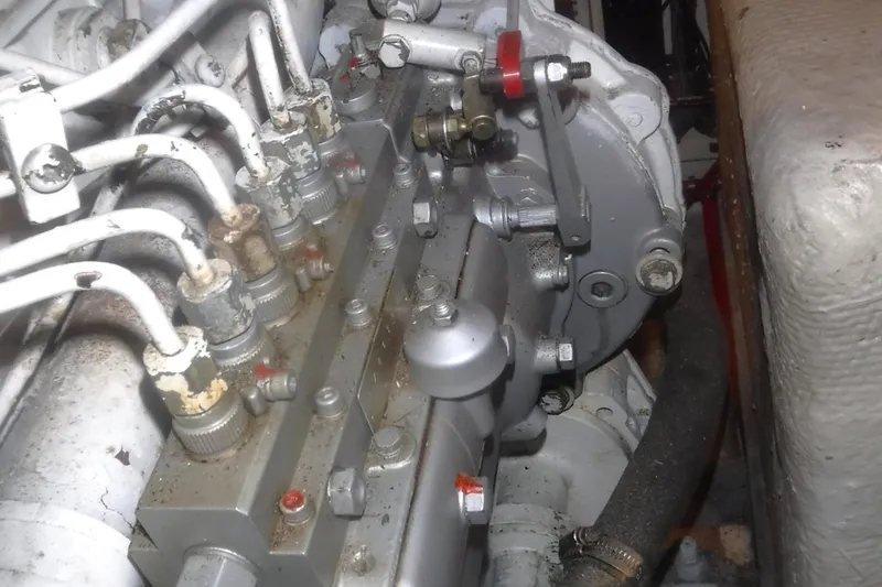 Slide: The Image of Engine components of a 1983 Grand Banks 36 Classic boat, showcasing intricate mechanical details. - 58