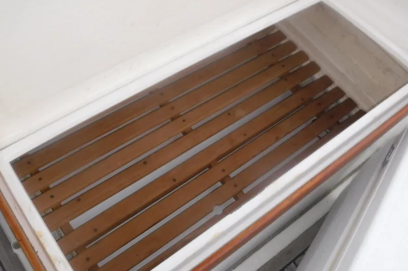 Slide: The Image of Wooden slatted compartment on 1983 Grand Banks 36 Classic boat. - 6