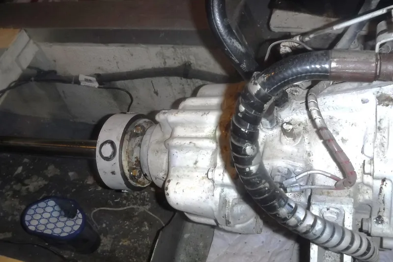 Slide: The Image of Engine compartment of a 1983 Grand Banks 36 Classic boat, showing mechanical components. - 60