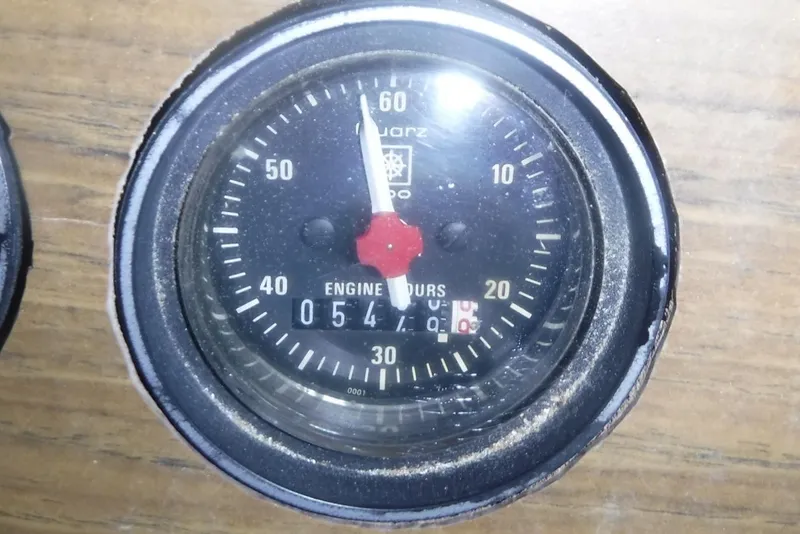 Slide: The Image of Analog engine hour meter on 1983 Grand Banks 36 Classic boat dashboard. - 62
