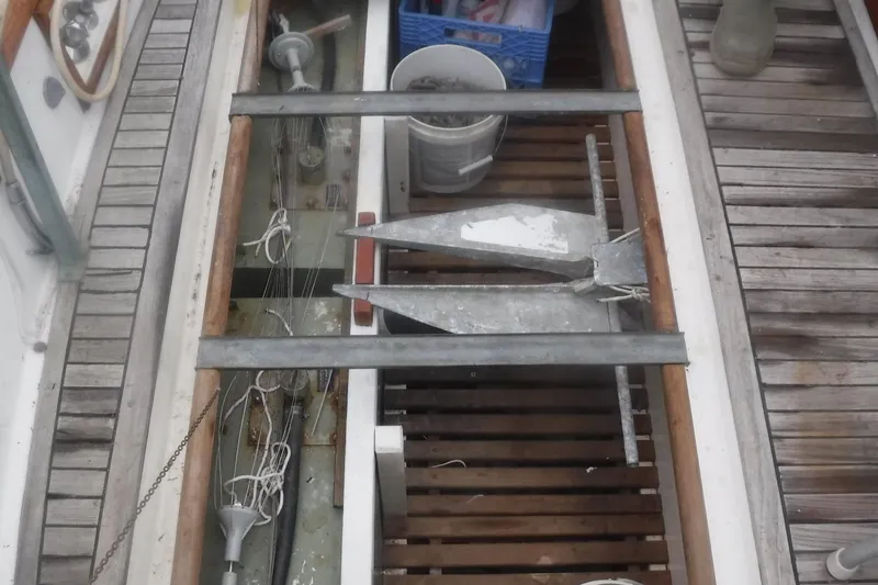 Slide: The Image of Storage compartment on a 1983 Grand Banks 36 Classic boat with anchor and equipment. - 63