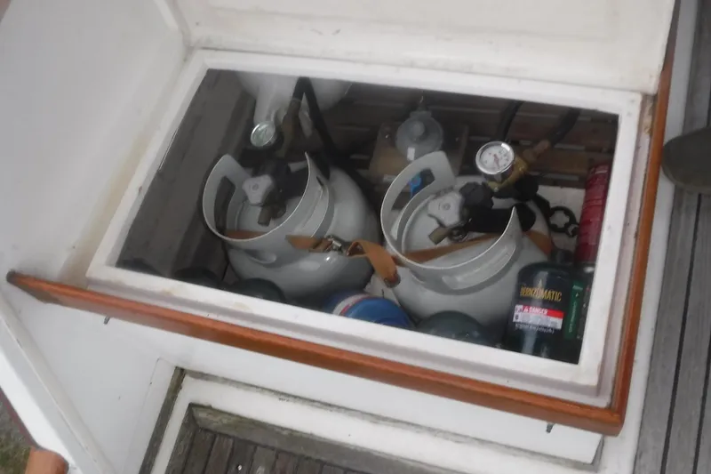 Slide: The Image of Storage compartment with propane tanks on a 1983 Grand Banks 36 Classic boat. - 7