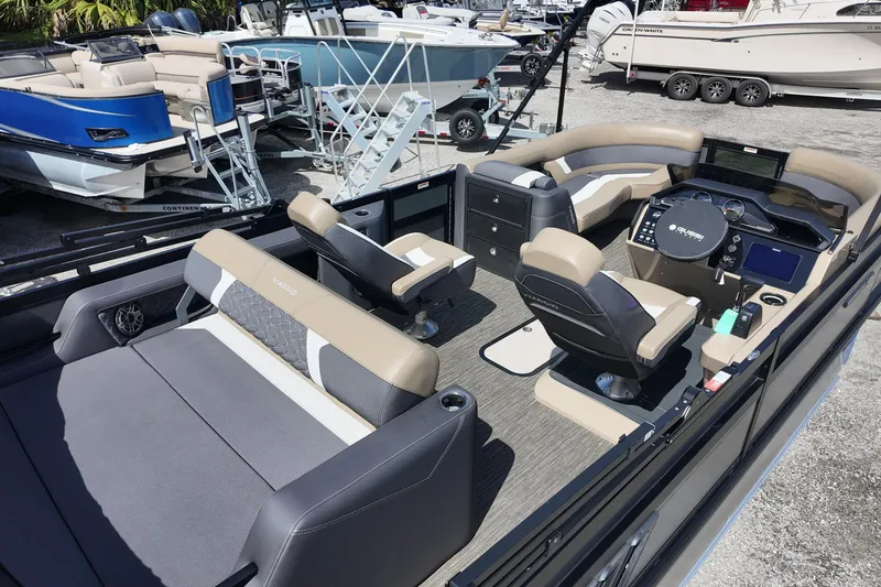 Slide: The Image of 2026 Viaggio Diamante D22S pontoon boat interior with modern seating and control panel. - 10