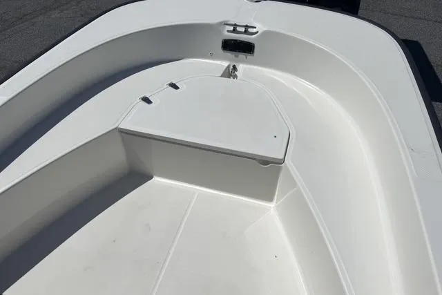 Slide: The Image of 2017 Boston Whaler 170 Montauk boat interior, featuring a clean, white deck design. - 12