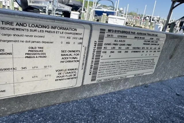 Slide: The Image of Label on a 2017 Boston Whaler 170 Montauk trailer, showing tire and loading information. - 13