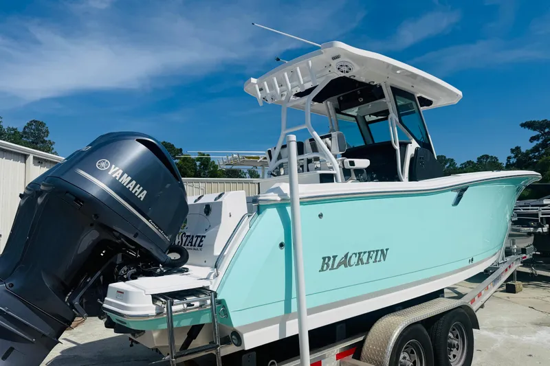 Slide: The Image of 2021 Blackfin 272 CC boat with Yamaha engine on trailer, outdoors. - 6