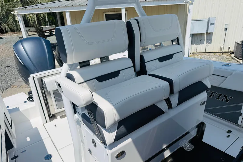 Slide: The Image of 2021 Blackfin 272 CC boat with dual white cushioned seats and sleek design. - 7