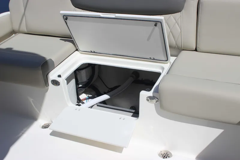 Slide: The Image of Open storage compartment on 2026 Key West 249 FS boat seat. - 17