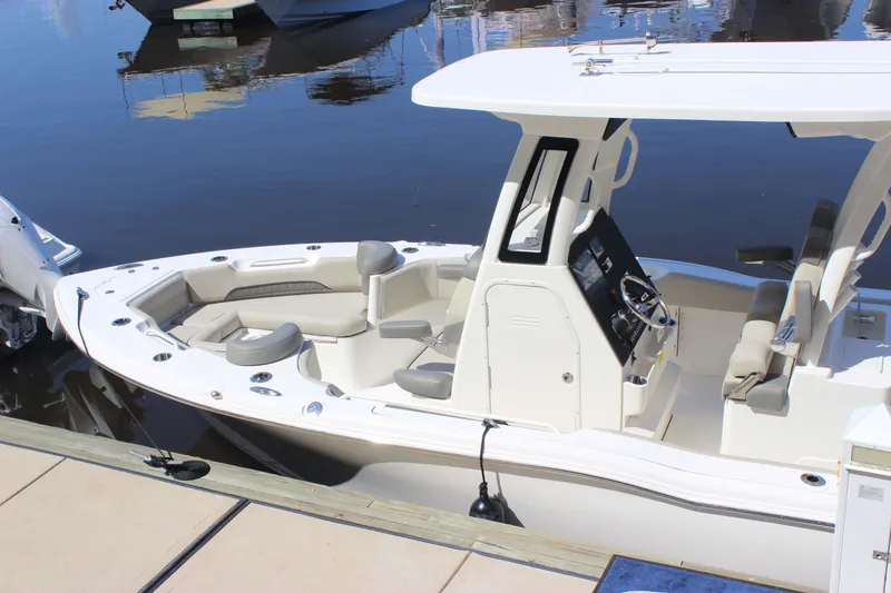 Slide: The Image of 2026 Key West 249 FS boat docked, featuring sleek design and spacious seating. - 18