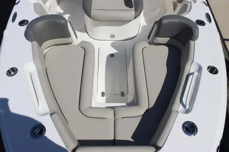 Slide: The Image of 2026 Key West 249 FS boat interior with cushioned seating and storage compartment. - 4