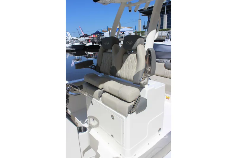 Slide: The Image of 2026 Key West 249 FS boat seating with luxurious upholstery at a marina. - 7