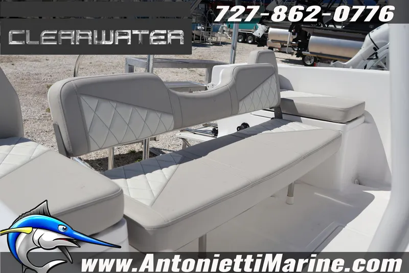 Slide: The Image of 2026 Clearwater 2000 Center Console boat interior with cushioned seating, showcased by Antonietti Marine. - 3