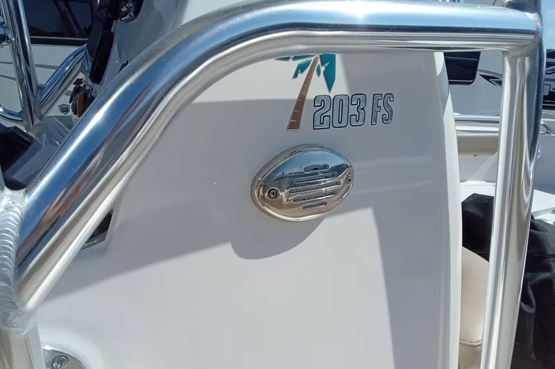 Slide: The Image of 2015 Key West 203 FS boat with chrome railing and logo detail. - 16