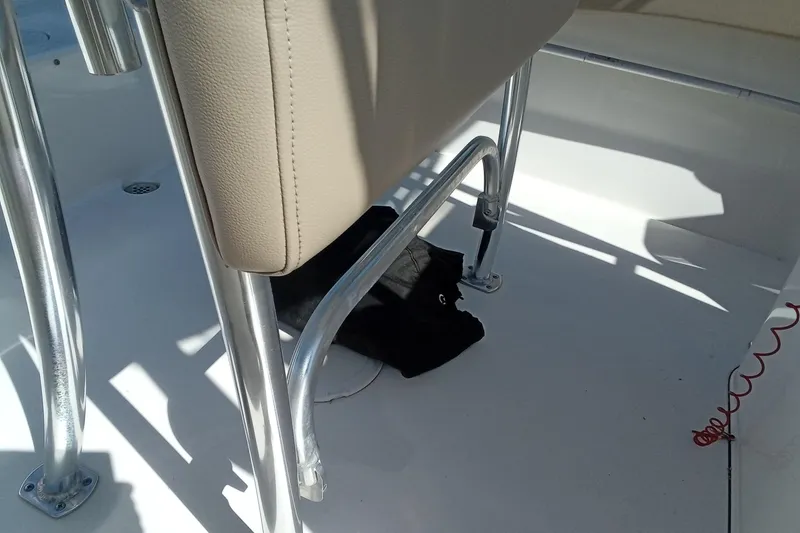 Slide: The Image of Interior view of a 2015 Key West 203 FS boat, featuring seating and metal framework. - 18