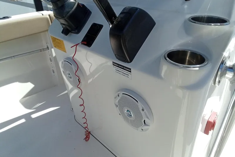 Slide: The Image of 2015 Key West 203 FS boat console with speakers and cup holders. - 19