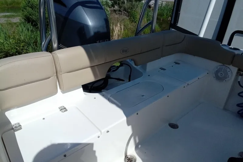 Slide: The Image of 2015 Key West 203 FS boat interior with seating and storage compartments. - 20
