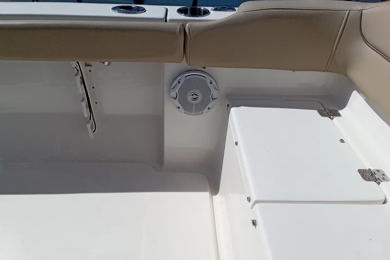 Slide: The Image of Interior of 2015 Key West 203 FS boat showing seating and speaker detail. - 23