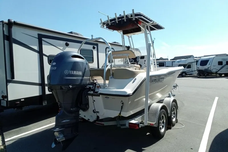 Slide: The Image of 2015 Key West 203 FS boat with Yamaha engine on trailer in parking lot. - 28