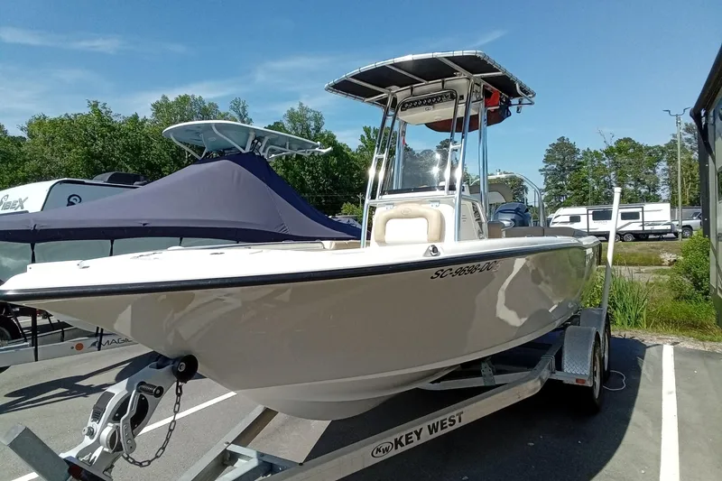 Slide: The Image of 2015 Key West 203 FS boat on trailer in parking lot, sunny day. - 31