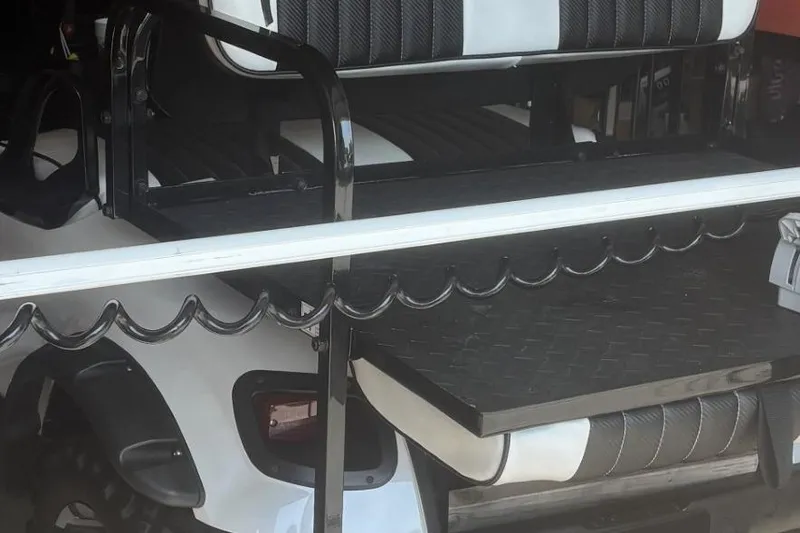 Slide: The Image of Rear view of a 2015 Key West 203 FS boat with black and white seating. - 4