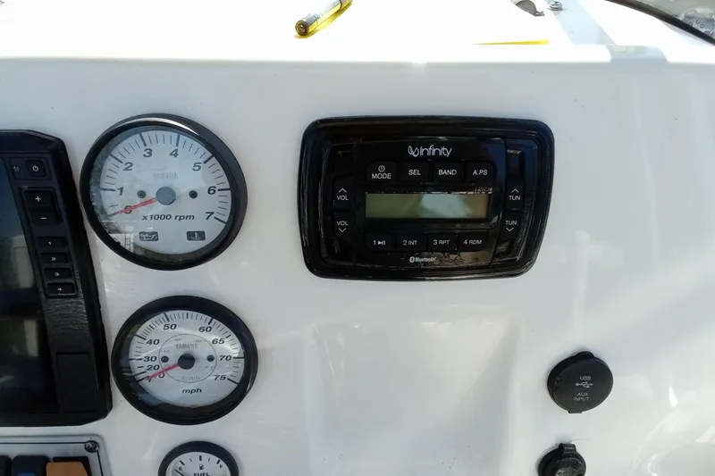 Slide: The Image of Dashboard of 2015 Key West 203 FS boat with gauges and Infinity stereo system. - 7