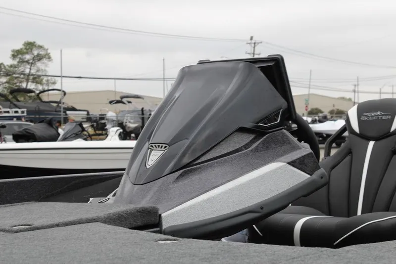 Slide: The Image of 2026 Skeeter ZXE21 boat with sleek design and modern seating, displayed outdoors. - 17