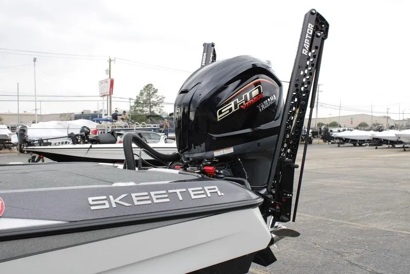 Slide: The Image of 2026 Skeeter ZXE21 boat with Yamaha engine in a dealership lot. - 4