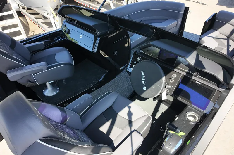 Slide: The Image of Interior of 2026 Viaggio Diamante 22UW boat with modern steering and seating. - 6