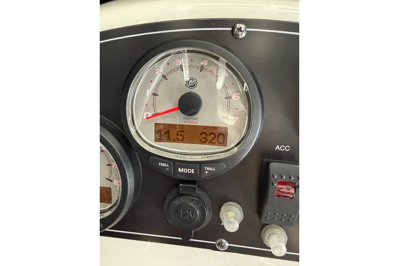 Slide: The Image of Close-up of 2018 Boston Whaler 210 Montauk boat dashboard, showing RPM gauge and controls. - 16