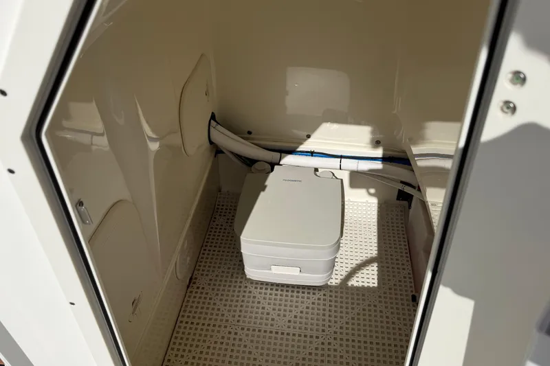 Slide: The Image of Interior of a 2018 Boston Whaler 210 Montauk boat with portable toilet. - 9