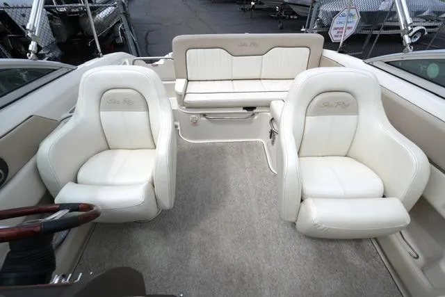 Slide: The Image of Interior of a 2010 Sea Ray 220 Sundeck boat with white seating. - 8