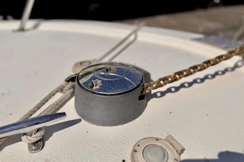 Slide: The Image of Close-up of a 1970 Bertram boat deck with chain and cleat details. - 22