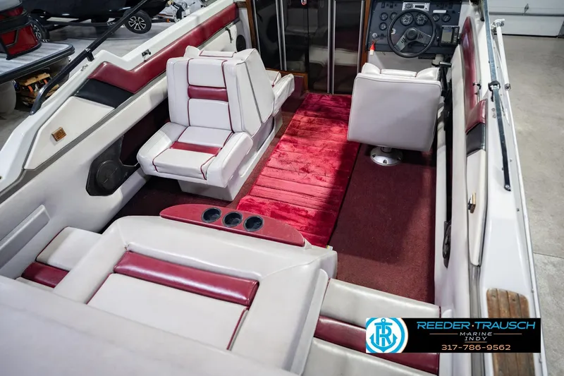 Slide: The Image of Interior of a 1986 Regal Sebring 195 boat with red and white seating. - 14