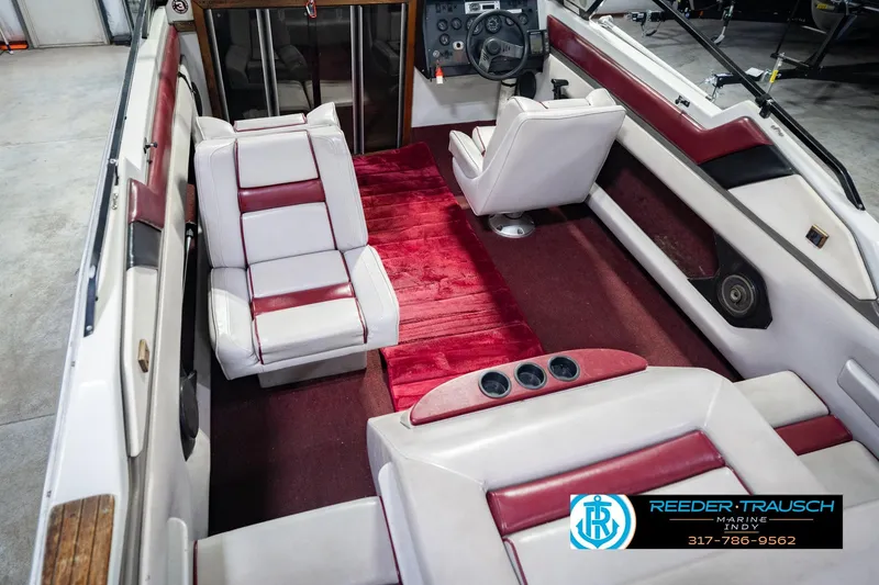Slide: The Image of Interior of a 1986 Regal Sebring 195 boat with red and white seating. - 16