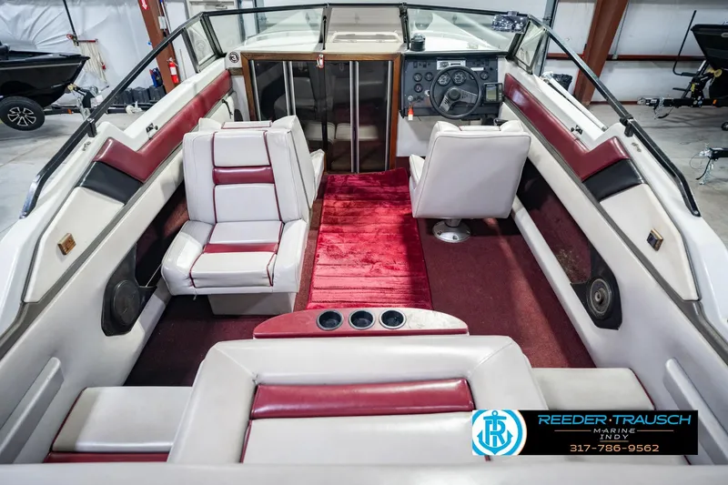 Slide: The Image of Interior of a 1986 Regal Sebring 195 boat with red and white seating. - 17