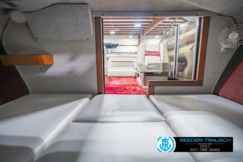 Slide: The Image of Interior of a 1986 Regal Sebring 195 boat with seating and red carpet. - 21