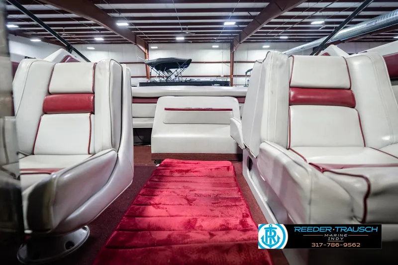 Slide: The Image of Interior of a 1986 Regal Sebring 195 boat with white and red seating. - 22
