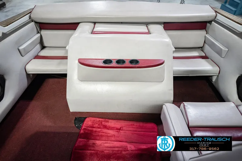 Slide: The Image of Interior of a 1986 Regal Sebring 195 boat with red and white seating. - 24