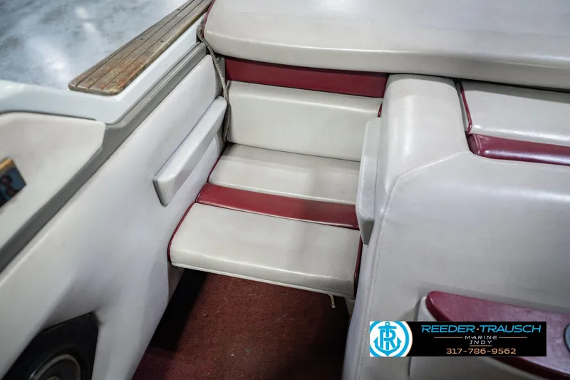 Slide: The Image of Interior seating of a 1986 Regal Sebring 195 boat with red and white upholstery. - 25