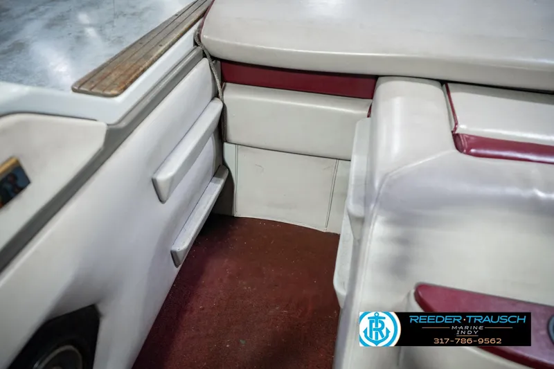 Slide: The Image of Interior of a 1986 Regal Sebring 195 boat with red and white seating. - 26